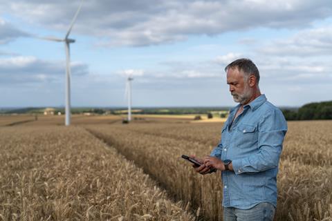 1. Farmer with Mobile phone - GettyImages